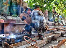 worker welds a structure