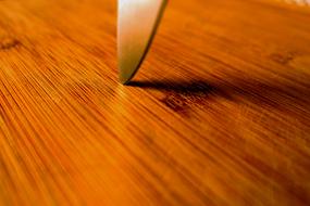 The Tip Knife in wooden surface