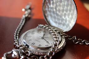 antique pocket watch on a chain