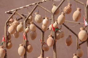 hanging pottery on the tree as a tradition