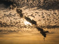 industrial smoke in the evening sky