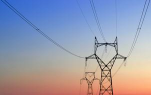 towers with electric wires in the evening