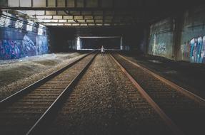 man in empty railway station