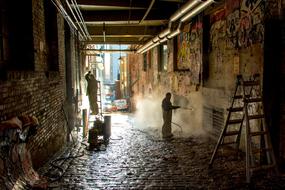 Workers Cleaning Graffiti