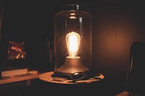 a light bulb under a glass dome