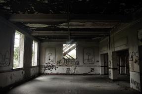 empty abandoned building with graffiti on the walls