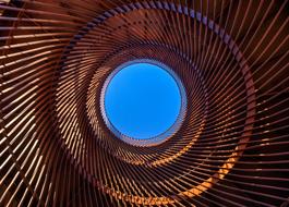 view of the sky through the industrial orange roof