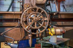 Metal wheel on a lathe in light