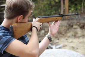 shooting man with rifle