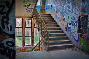 colorful graffiti on abandoned stairs