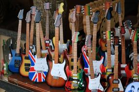 colorful electric guitars, Wooden Souvenirs on stall