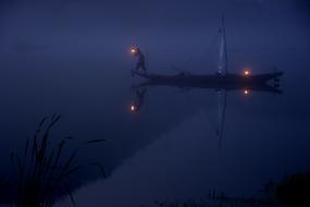 Fisherman on Night lake