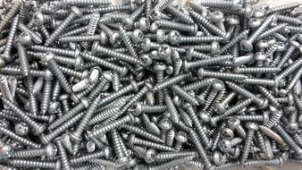 a lot of tapping screws in a box