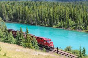 red train near Bow River