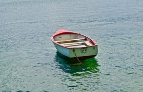 Boat anchored on calm Water
