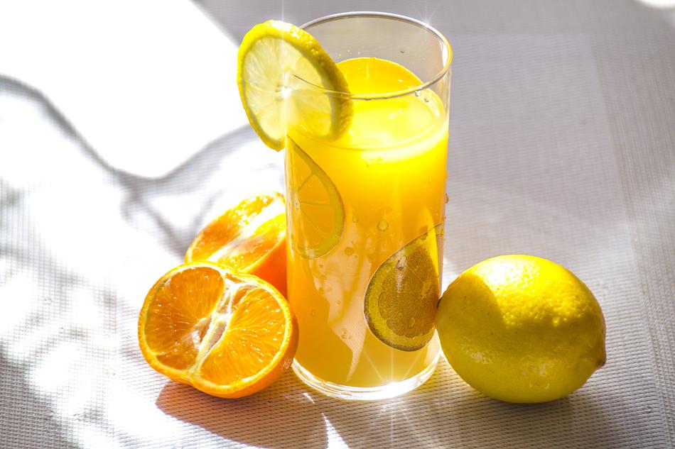 Citrus Fruit Juice in glass at sunlight