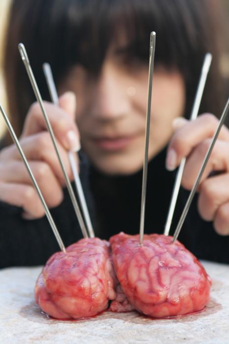 person pushing sewing needles in Brain