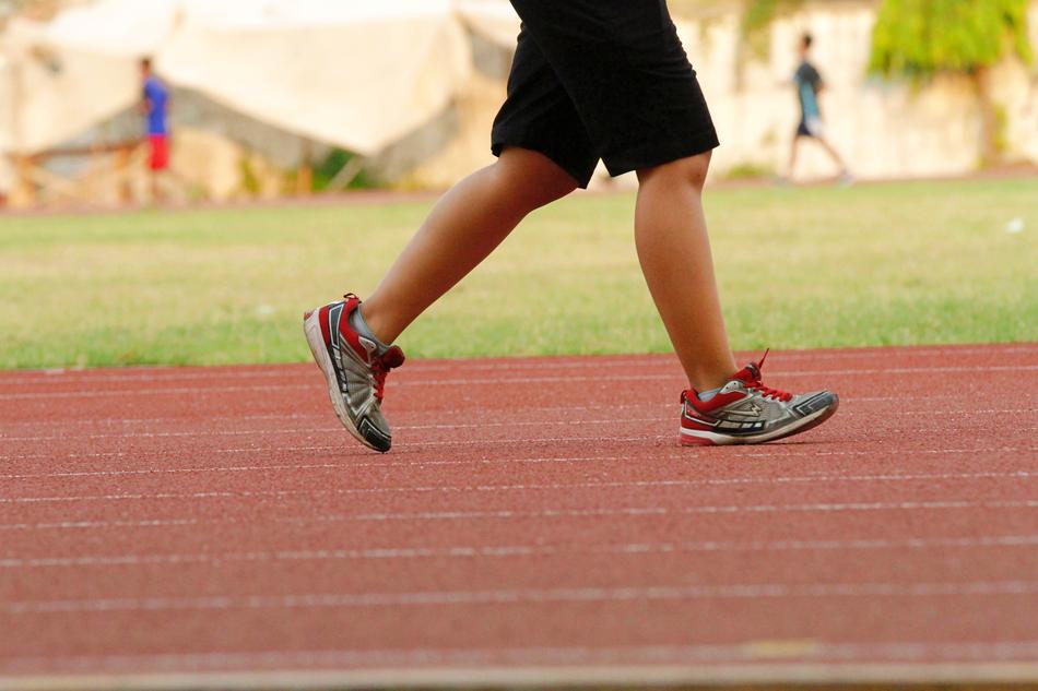 runner's feet on the track