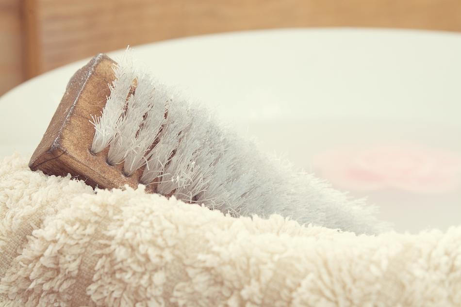 wash brush and towel in the basin close-up on blurred background