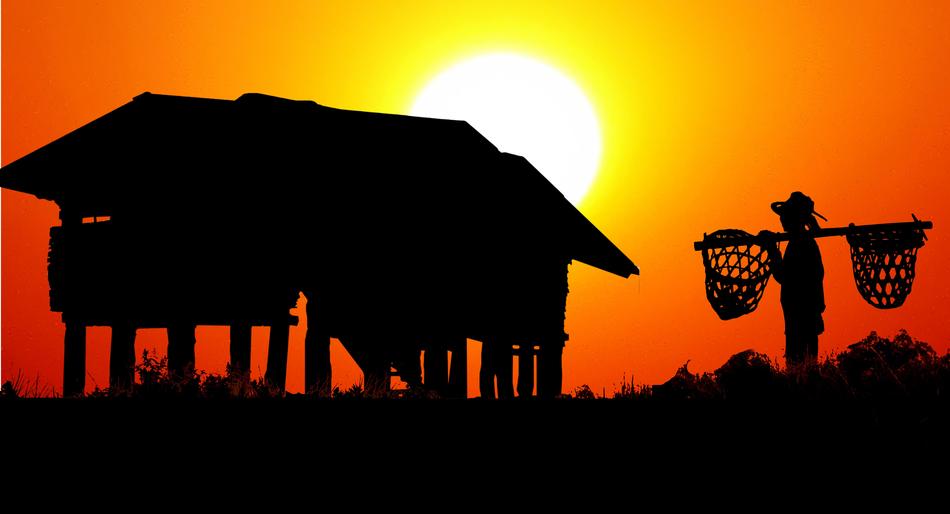 farmer rural hut work at sunset in asia