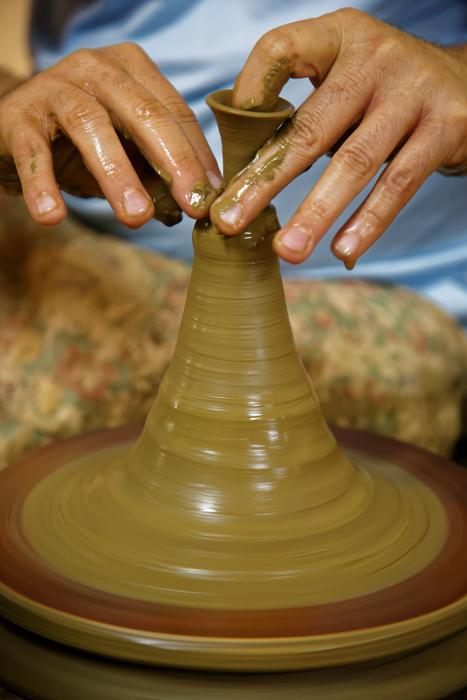Potterâs Hands working with Clay
