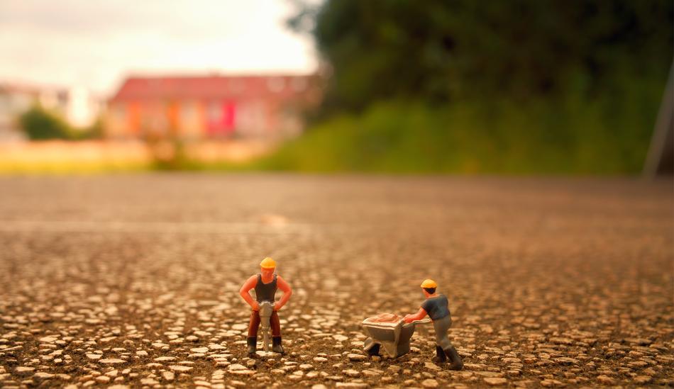 mini figures of builders in a blurred background