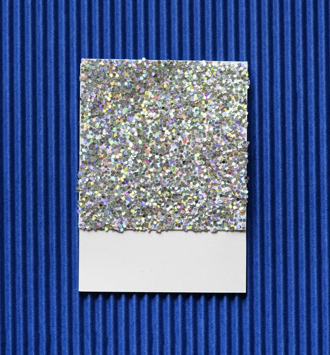 colored sheet of paper on a blue background