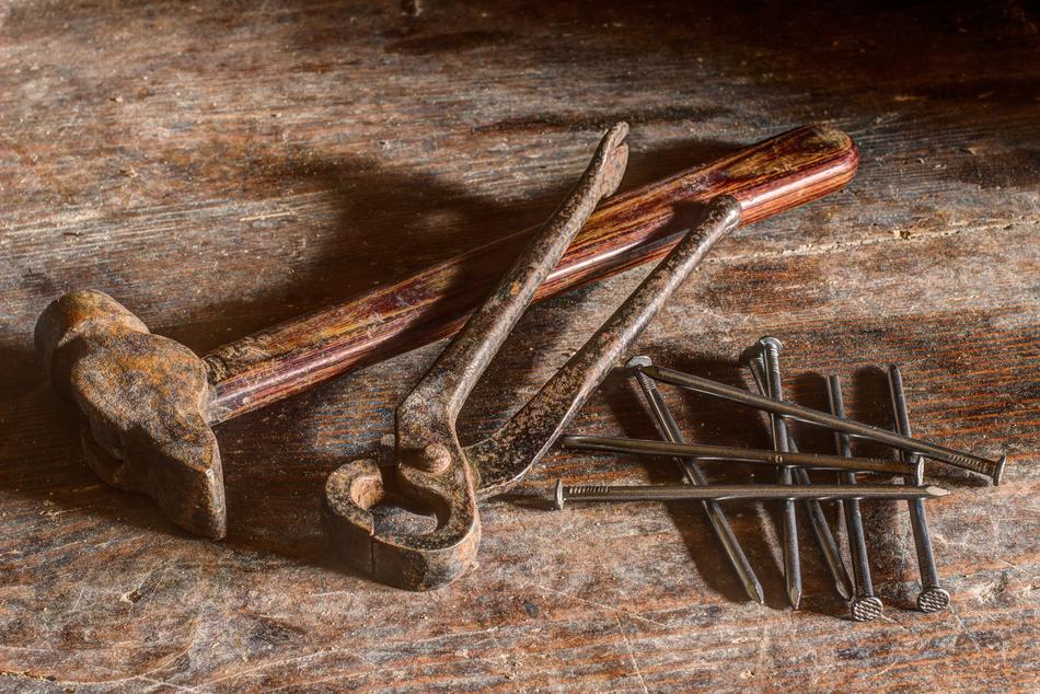 rusty tools on the table near the nails