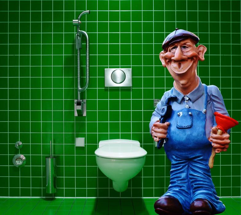 Plumber Figure in a green bathroom