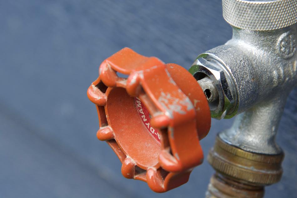 red handle on the pipe close-up