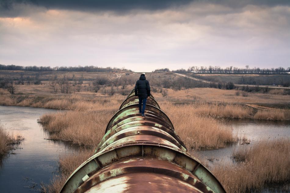 Person Walking on old Pipeline