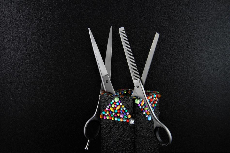 hairdressing scissors in a decorative glass