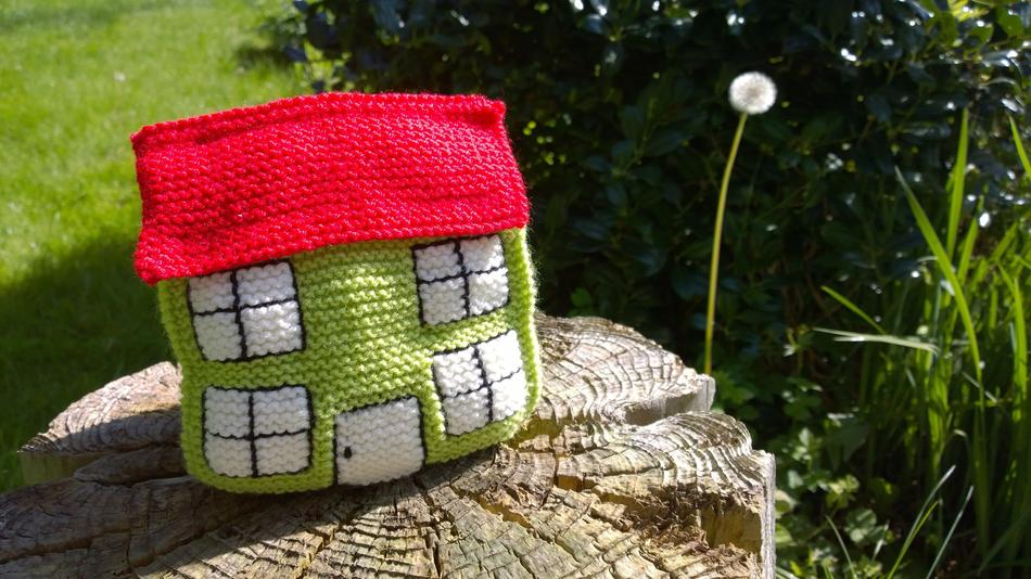 knitted house on a stump