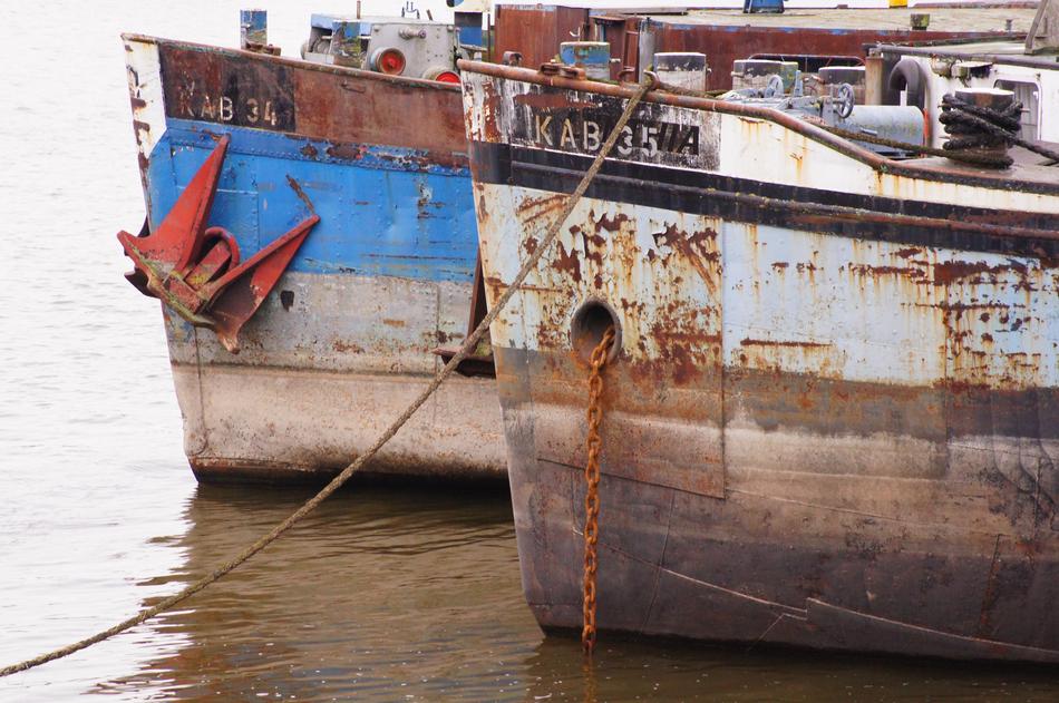 rusty ships in the port