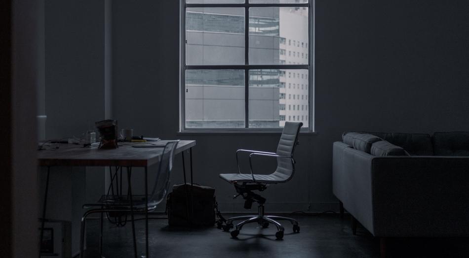 black and white photo of the office with the interior and window