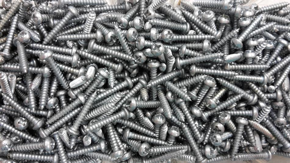 a lot of tapping screws in a box