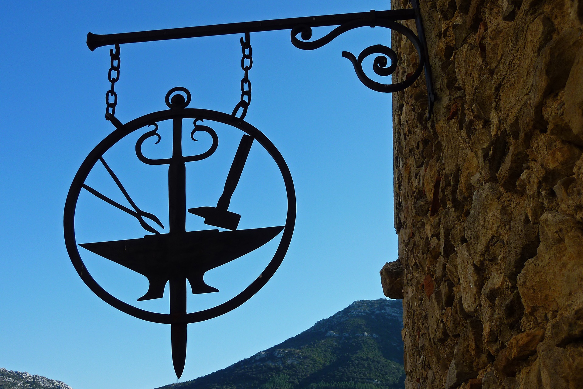 Forge emblem on the facade of the building free image download