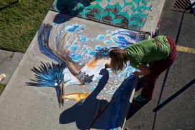 girl Drawing with Chalk outdoor
