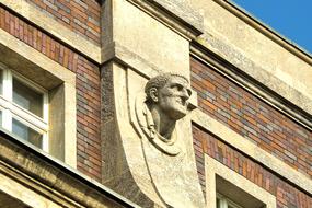 stone face on building facade
