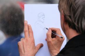 man drawing a sketch