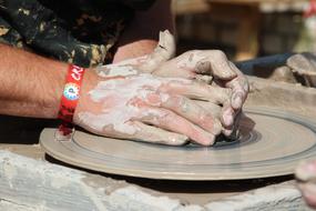 hands of Potter Forming Clay