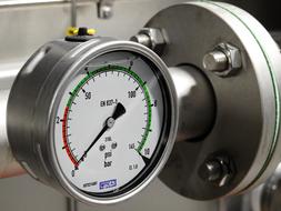 a pressure gauge on the pipe at the factory