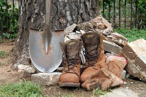 Work Boots and Gloves near a big tree