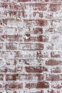 Brick Wall covered with weathered white paint, Background