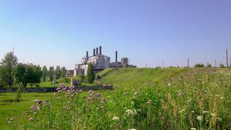 Industry Energy Of Technology and green grass and flowers
