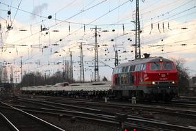 photo of a locomotive with a platform on the railway