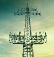powerful power line against the sky at sunset