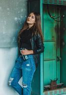 Posing girl near the abandoned building