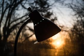 table lamp on the window at dawn background