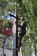 Statue man and cross